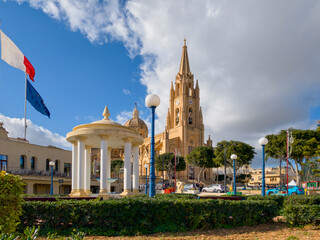 Ghajnsielem Parish Church in Gozo with neo-gothic spire and town square