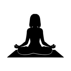 Black silhouette of a woman practicing yoga in lotus pose on a mat without background.