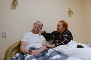 Portrait of an active senior couple, portrait of an elderly man with his wife in park outdoors. Support love and care concept. High quality photo