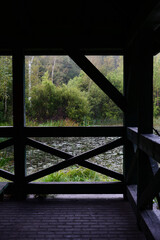 Fototapeta premium window, view, architecture, wooden, nature, landscape, water, sky, trees, wood, green, summer, old, house, blue, tree, building, construction, road, park, city