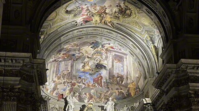 Ornate apse frescoes above the main altar in the Church of St. Ignatius of Loyola. Detailed biblical scenes cover the ceiling and upper walls. Rome,