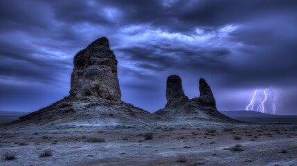 Jagged volcanic rock formations silhouetted against a dramatic stormy twilight sky