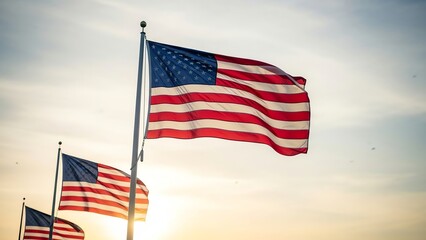 Obraz premium American flags waving against a sunset sky