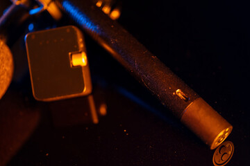 Close up on a professional boom microphone system on black background. © CesareFerrari