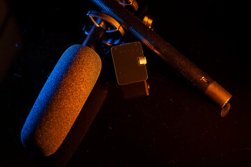 Close up on a professional boom microphone system on black background. © CesareFerrari