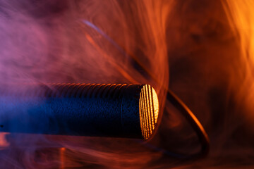 Close up on a professional boom microphone system on black background. © CesareFerrari