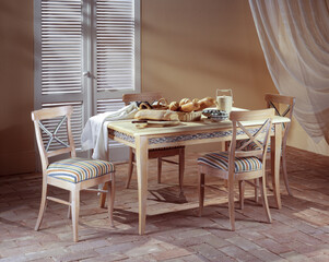 Single shot photo of a room with dining table and chairs
