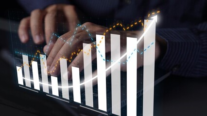 A close-up of hands typing on a keyboard, combined with a dynamic graph overlay that illustrates growth, data analysis, and business success in a modern office setting. Copula