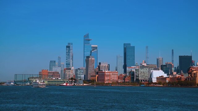Manhattan skyline view from Hudson River. Wide view of Hudson Yards and Midtown towers from the Hudson River.