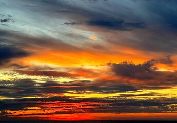 Sunset sky ominous dark red clouds