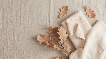 linen napkin with oak leaves on textured background.