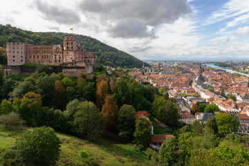 Old Town in Sun Below Heidelberg Castle.A high angle view of Heidelberg Castle and the old town next to the Neckar River. Heidelberg, Germany.
