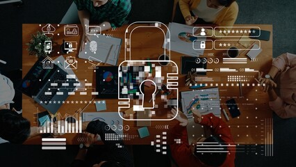 A diverse group of professionals collaborates over digital devices on a conference table, focusing on secure data management and encryption strategies in a modern workspace. Raster