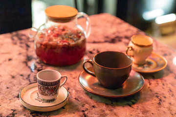Fototapeta premium Vintage Cups and Herbal Teas on Cafe Table