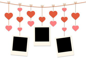 blank instant photo frames hanging on heart strings