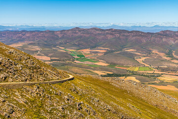 A view towards a bend on the Swartberg pass in the Swartberg mountains in South Africa in springtime