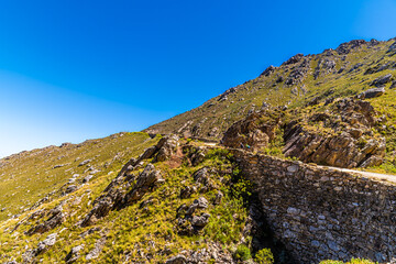 A view up a reinforced section of the Swartberg pass in the Swartberg mountains in South Africa in springtime