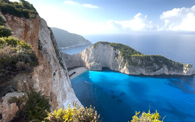 Breathtaking view of Navagio Beach with turquoise waters and rugged cliffs in Greece