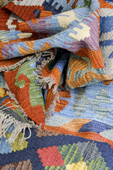 Group of assorted carpets and rugs of various sizes and colors