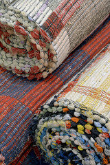 Group of assorted carpets and rugs of various sizes and colors