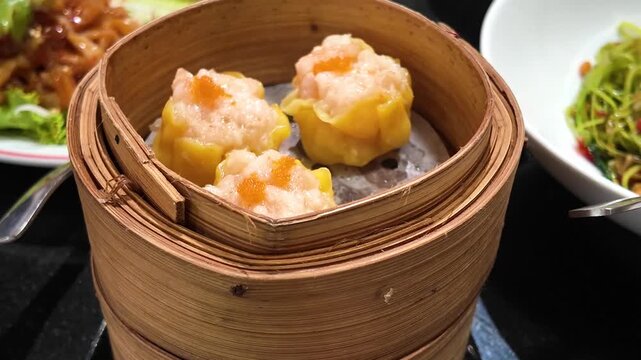 Closeup of siu mai in bamboo steamer

