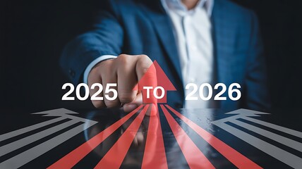 Businessman pointing to a red arrow with 2025 to 2026 written on it