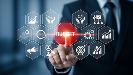 A hand touching a glowing digital budget concept with icons representing finance and business planning