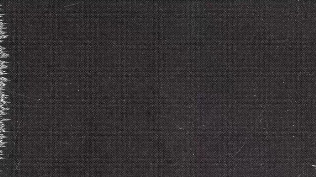 Dark fabric texture background with damage and edge fray