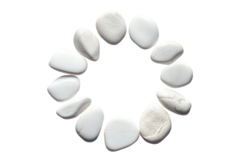Circle of smooth white pebbles arranged on a black background isolated on transparent background. White stones arranged in a circular pattern isolated on white background.