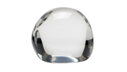 Clear glass paperweight with rounded shape on white background