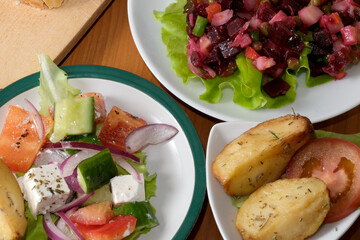 Delicious salad and roasted potato feast in a cozy setting