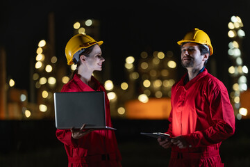Engineers team night shift working oil and gas refinery service, Workers hard work at night petroleum industry plant background.