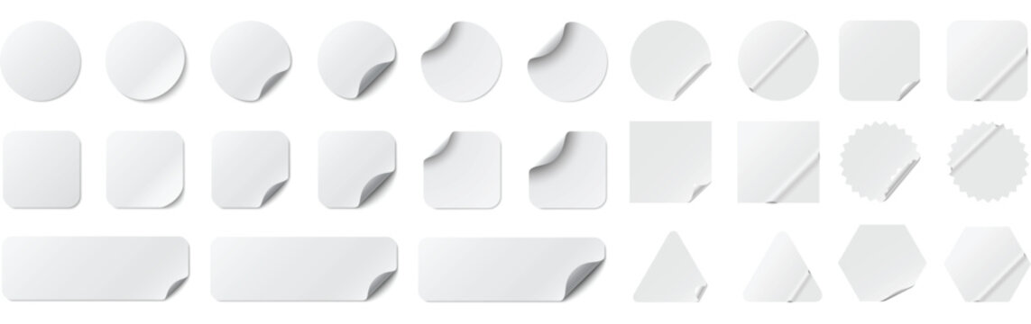 A comprehensive vector collection of realistic blank white stickers and adhesive labels in various geometric shapes, including circles, squares, rectangles, triangles, hexagons, and starbursts.