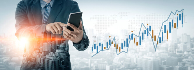A businessman in a suit uses a tablet to analyze financial data, with a stock market graphic overlay and a cityscape background, representing modern business analytics. Gantry