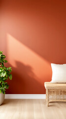 Cozy interior with orange wall, wicker bench, cushion, and green plant