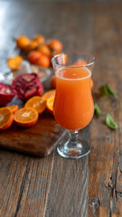 a glass of citrus fruit juice on table