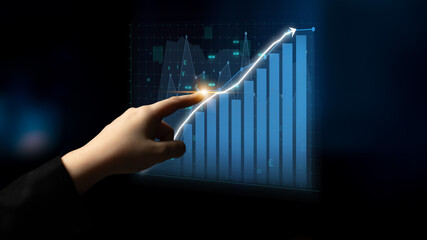A hand points towards a digital financial graph depicting an upward trend, symbolizing growth and progress in the context of data analysis and business strategy. Impute