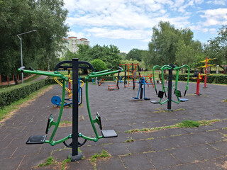 Outdoor sports ground in city park. Colorful exercise equipment