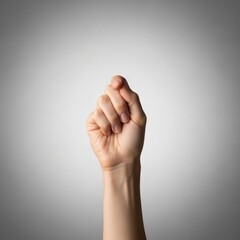 Human Hand Clenched into a Strong Fist Gesture Symbolizing Strength and Determination
