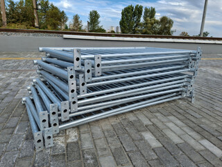 Metal frameworks for fence near railway. Metal structures for fencing