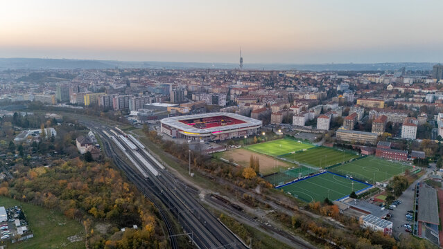 Prague, Czech Republic - November 8, 2025: Aerial view of Prague with Fortuna Arena football stadium at sunset.