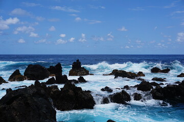 Dramatic Turquoise Ocean Waves Crashing on Black Volcanic Rocks 