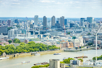 Cityscape view of the Thames, featuring a mix of historic and modern architecture in London, UK