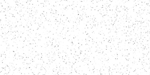 Subtle mosaic pattern of scattered small irregular gray and white fragments creating a textured speckled abstract background for design and decoration