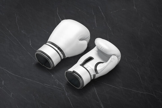 Blank white boxing gloves pair mockup lying, black background