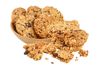Granola cookie in wooden bowl isolated on white background with full depth of field.