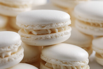 Delicate white macaroons stacked elegantly, showcasing their smooth texture and subtle sweetness in a delightful arrangement