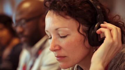 Medium shot of a parent attentively listening during an audioonly family support session creating a safe and private space for open conversation.
