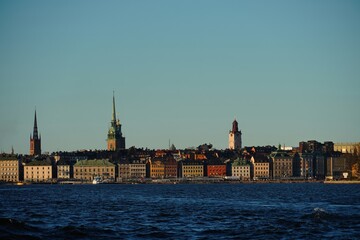 Fototapeta premium Stockholm Waterfront Skyline with Historic Buildings and Church Towers