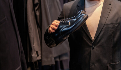 Shoe store. Business man choose elegant footwear in shop. Classic leather shoes for formal look. Formal shoe. Leather footwear. Shop assistant man in shoe store hold classic footwear